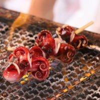 Skewer of grilled mini octopus
